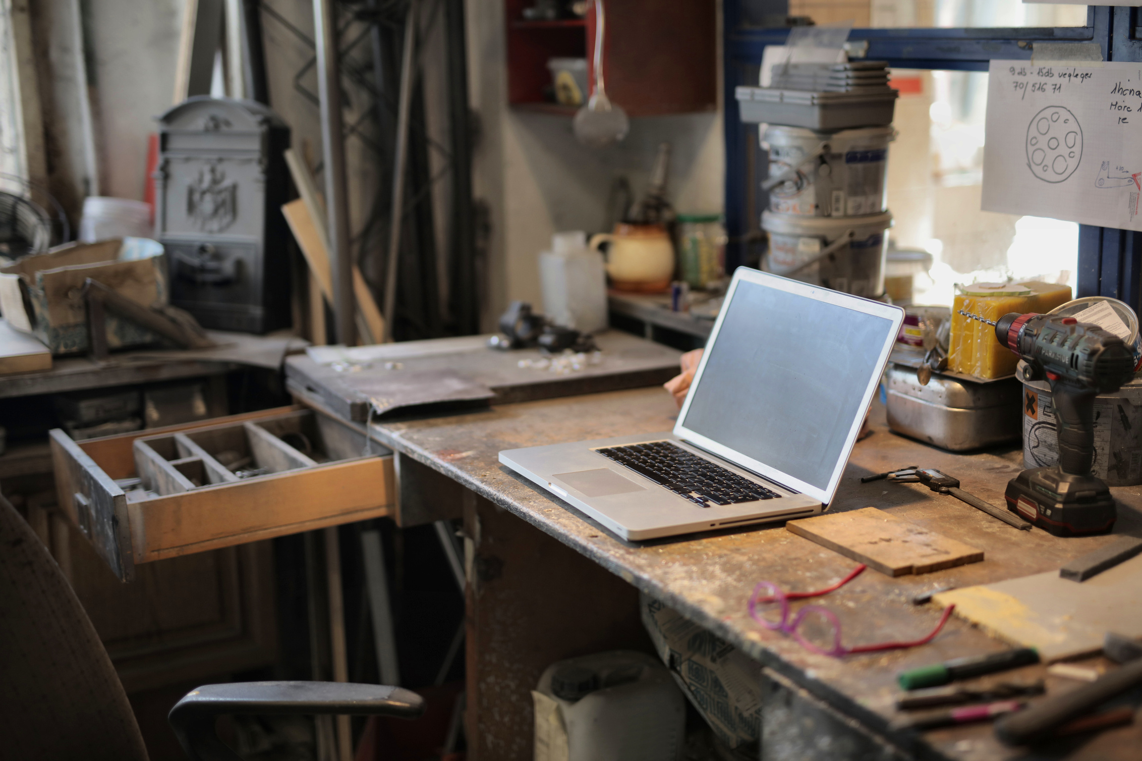 Laptop on table in workshop